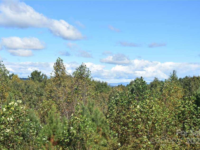 80 Grandview Loop, Nebo, NC 28761.  MLS# CAR4317495, YatesRealty ID 1300. View from the back deck that includes long range views of Table Rock and Calloway Peak.