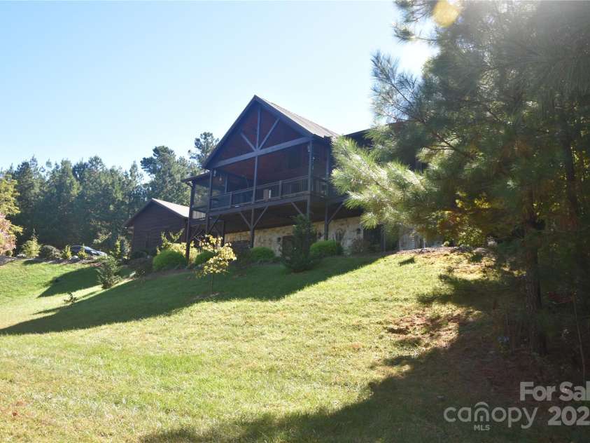 80 Grandview Loop, Nebo, NC 28761.  MLS# CAR4317495, YatesRealty ID 1300. View of the home from the large backyard.