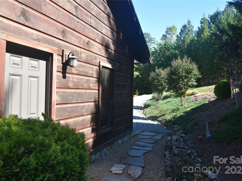 80 Grandview Loop, Nebo, NC 28761.  MLS# CAR4317495, YatesRealty ID 1300. Walkway and door to the detached garaged and driveway.