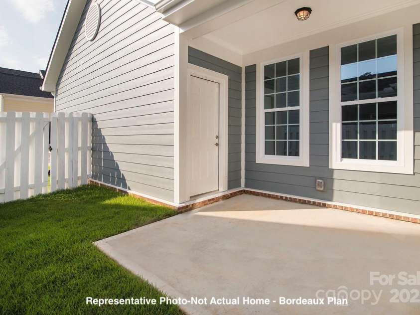 19732-B School Street, Cornelius, NC 28031.  MLS# CAR4235035, YatesRealty ID 13009. Example Side Patio-Bordeaux Plan