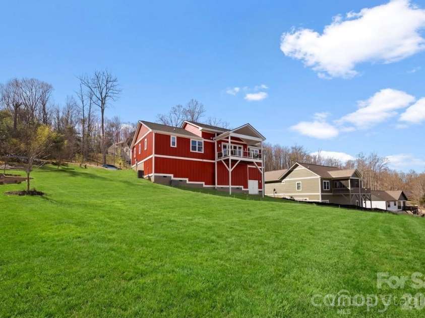 68 Carrie Drive, Hendersonville, NC 28792.  MLS# CAR4361651, YatesRealty ID 13011. Green grass is virtually enhanced
