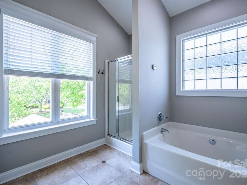 7409 Gilderstern Glen Court, Huntersville, NC 28078.  MLS# CAR4249870, YatesRealty ID 13015. Primary bath stall shower, tile floors