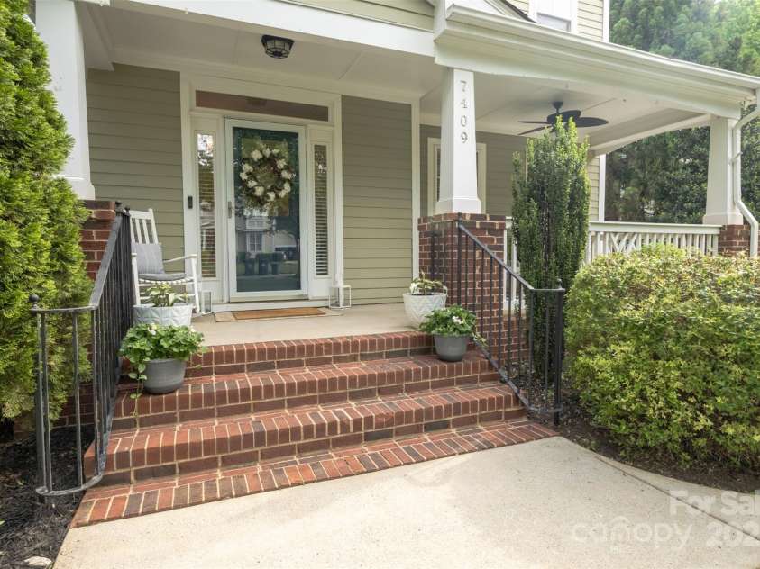 7409 Gilderstern Glen Court, Huntersville, NC 28078.  MLS# CAR4249870, YatesRealty ID 13015. Rocking Chair Covered Porch