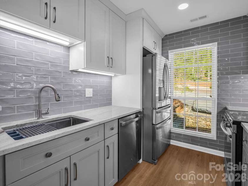 2881 White Oak Mountain Road, Columbus, NC 28722.  MLS# CAR4371234, YatesRealty ID 13027. Tile backsplash and solid surface counters