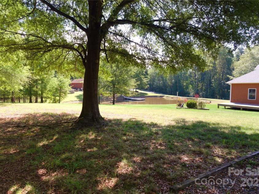 15027 Beatties Ford Road, Huntersville, NC 28078.  MLS# CAR4308450, YatesRealty ID 1303. Back of property view