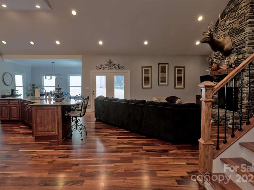15027 Beatties Ford Road, Huntersville, NC 28078.  MLS# CAR4308450, YatesRealty ID 1303. Kitchen and living room