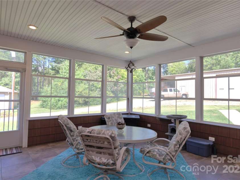 15027 Beatties Ford Road, Huntersville, NC 28078.  MLS# CAR4308450, YatesRealty ID 1303. Large screened in porch