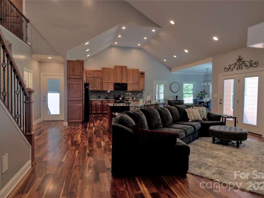 15027 Beatties Ford Road, Huntersville, NC 28078.  MLS# CAR4308450, YatesRealty ID 1303. Living room open to kitchen