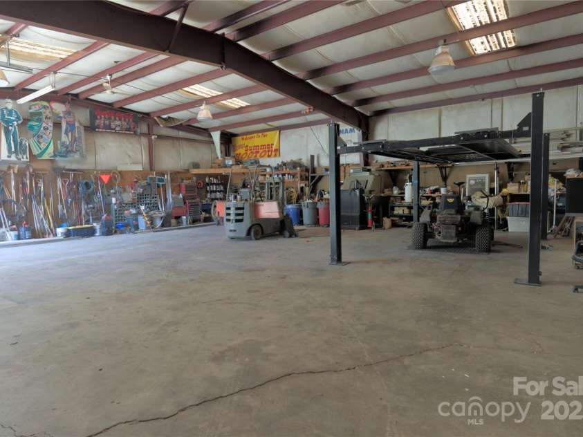 15027 Beatties Ford Road, Huntersville, NC 28078.  MLS# CAR4308450, YatesRealty ID 1303. Steel outbuilding