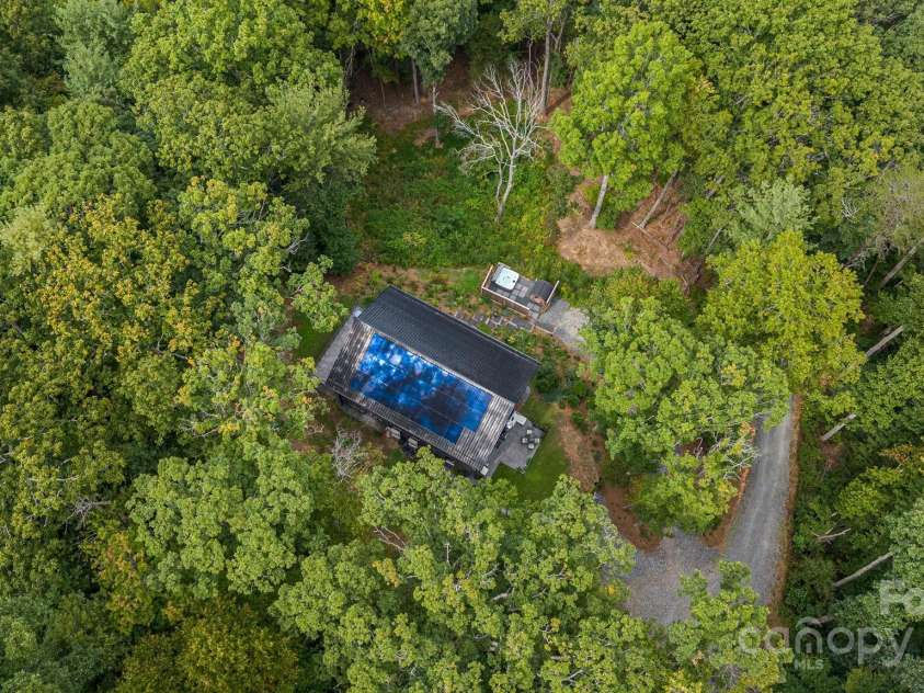 47 Webb Cove Road, Asheville, NC 28804.  MLS# CAR4234951, YatesRealty ID 13033. Aerial view of these luxury home with full solar array on the roof