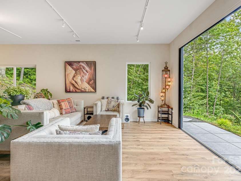 47 Webb Cove Road, Asheville, NC 28804.  MLS# CAR4234951, YatesRealty ID 13033. Experience the majesty of the outdoors while relaxing in your plush couch