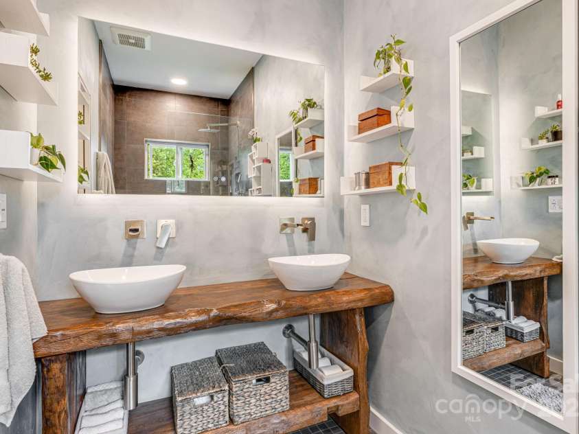 47 Webb Cove Road, Asheville, NC 28804.  MLS# CAR4234951, YatesRealty ID 13033. Modern two sink bathroom in the main level bedroom