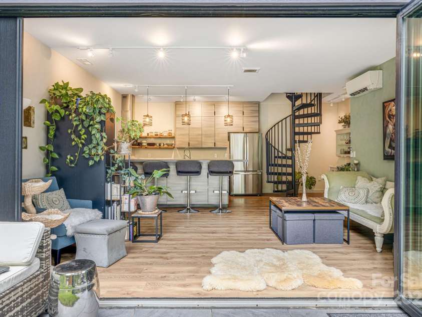 47 Webb Cove Road, Asheville, NC 28804.  MLS# CAR4234951, YatesRealty ID 13033. Outside looking into the second living area with open floor plan