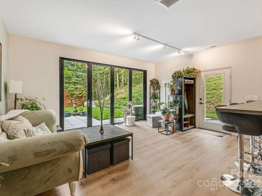 47 Webb Cove Road, Asheville, NC 28804.  MLS# CAR4234951, YatesRealty ID 13033. View of 2nd living area from corner where spiral staircase is located