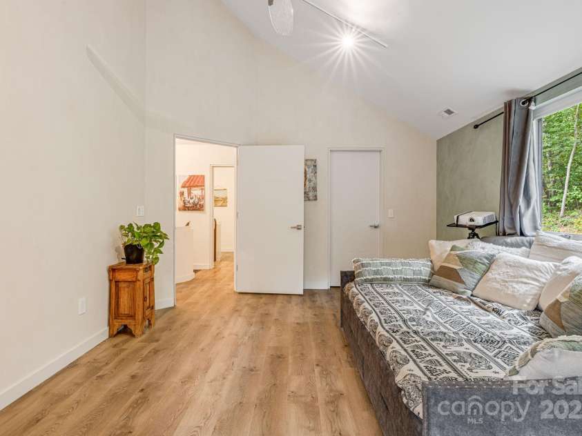 47 Webb Cove Road, Asheville, NC 28804.  MLS# CAR4234951, YatesRealty ID 13033. View of an upper bedroom from the door leading to upper deck