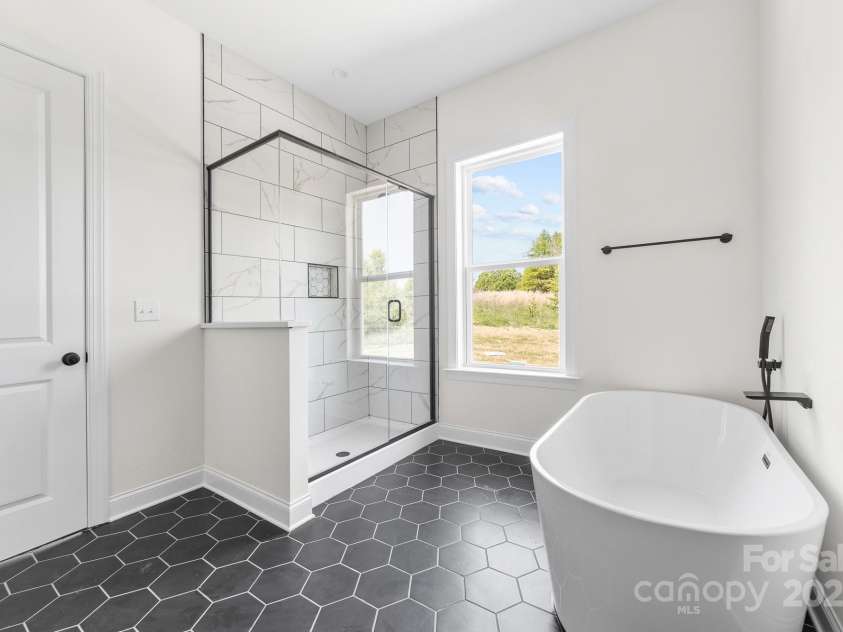 1037 Dameron Road, Bessemer City, NC 28016.  MLS# CAR4226755, YatesRealty ID 13043. Check out the Impressive Black Hexagon Tiled Floor with a Roomy Steam Shower and a Separate Large and Luxurious Soaking Tub! The Perfect Retreat to Steam or Soak off the Stress after a Long Hard Day!