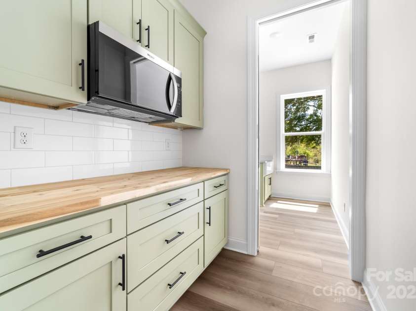 1037 Dameron Road, Bessemer City, NC 28016.  MLS# CAR4226755, YatesRealty ID 13043. View of Exceptional Butler's Pantry and Entrance to the Laundry Room