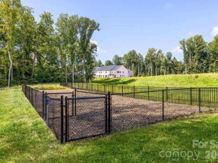 6007 Moonglade Lane, Charlotte, NC 28269.  MLS# CAR4326044, YatesRealty ID 13044. A dedicated dog park for your pups to play, explore, and make new friends.