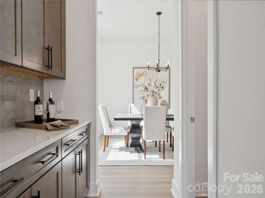 5107 Mint Harbor Way, Charlotte, NC 28269.  MLS# CAR4326148, YatesRealty ID 13045. Butler pantry and dining room