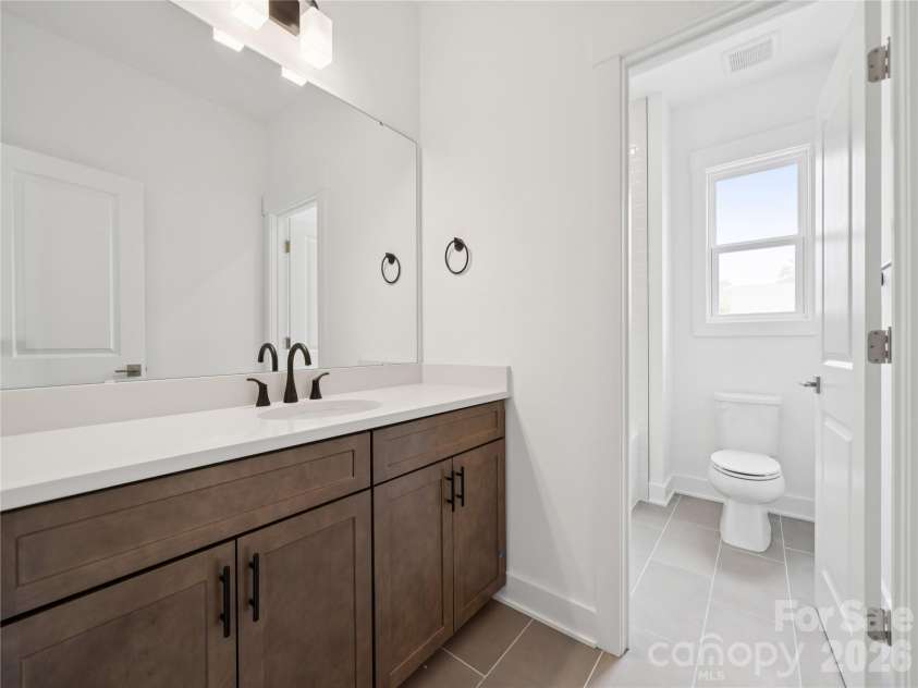 5107 Mint Harbor Way, Charlotte, NC 28269.  MLS# CAR4326148, YatesRealty ID 13045. Guest bath 