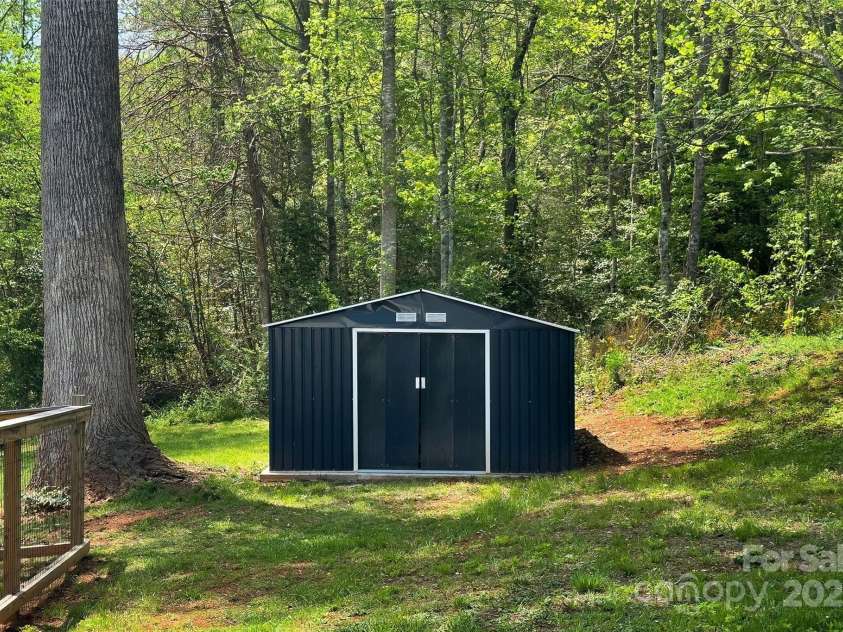 39 Holly Ridge Drive, Old Fort, NC 28762.  MLS# CAR4248406, YatesRealty ID 13049. Storage shed
