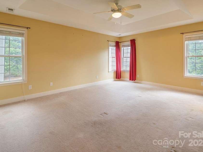 104 Double Brook Drive, Weaverville, NC 28787.  MLS# CAR4245056, YatesRealty ID 13057. Spacious primary bedroom