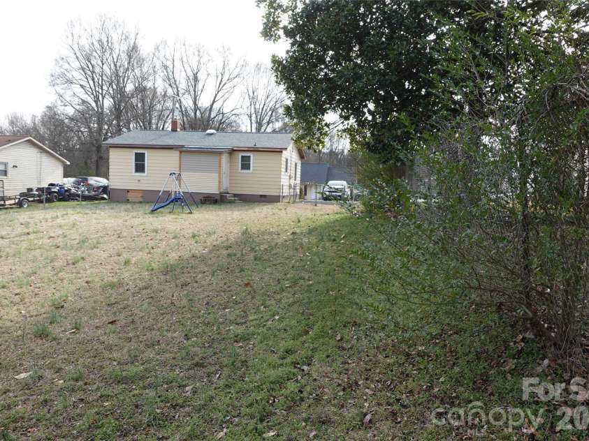155 Robbins Street, Concord, NC 28025.  MLS# CAR4351734, YatesRealty ID 13057. Rear view from back left yard