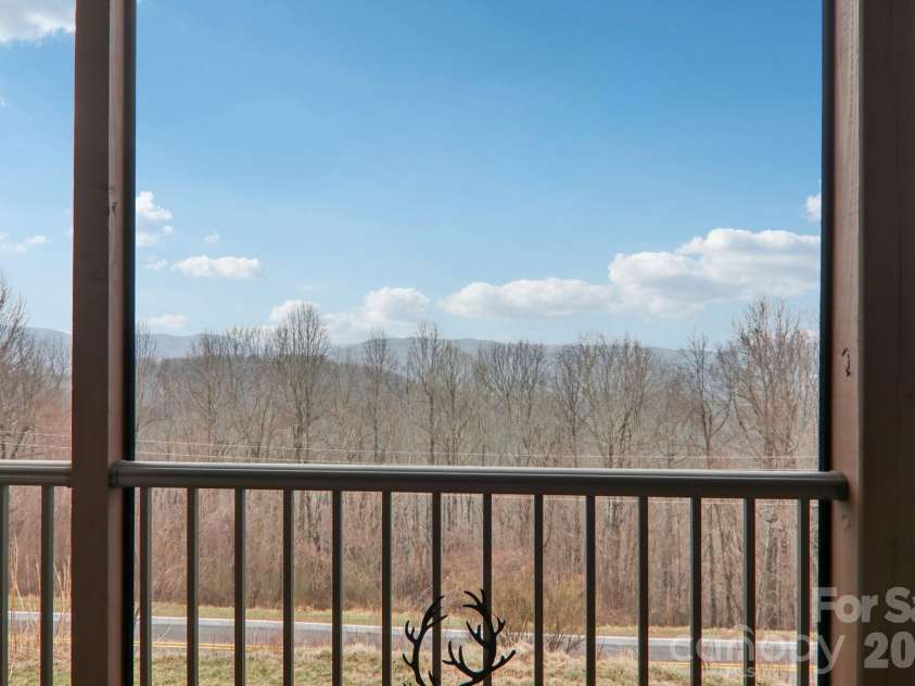 1601 Fleetwood Plaza, Hendersonville, NC 28739.  MLS# CAR4352883, YatesRealty ID 13058. Long range views from screened in porch