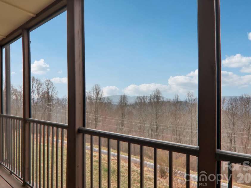1601 Fleetwood Plaza, Hendersonville, NC 28739.  MLS# CAR4352883, YatesRealty ID 13058. Long range views from screened in porch