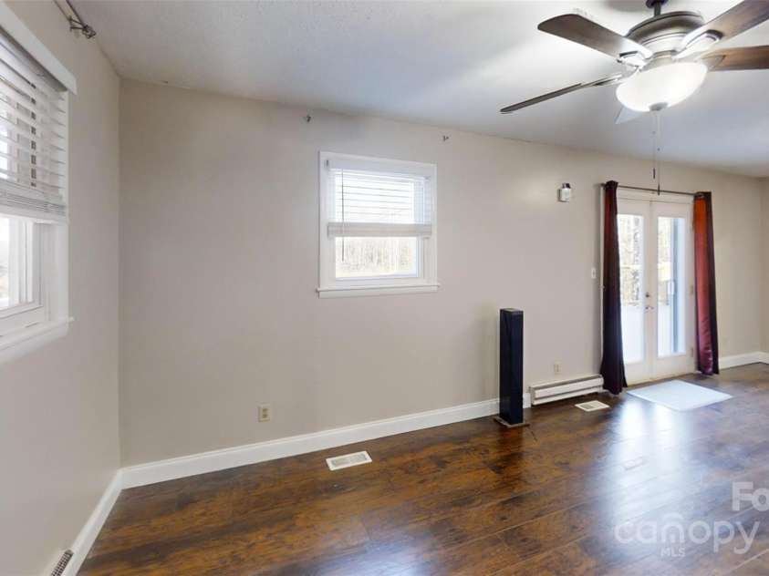 59 Upper Saw Branch Road, Candler, NC 28715.  MLS# CAR4226917, YatesRealty ID 13059. Living room view to front door