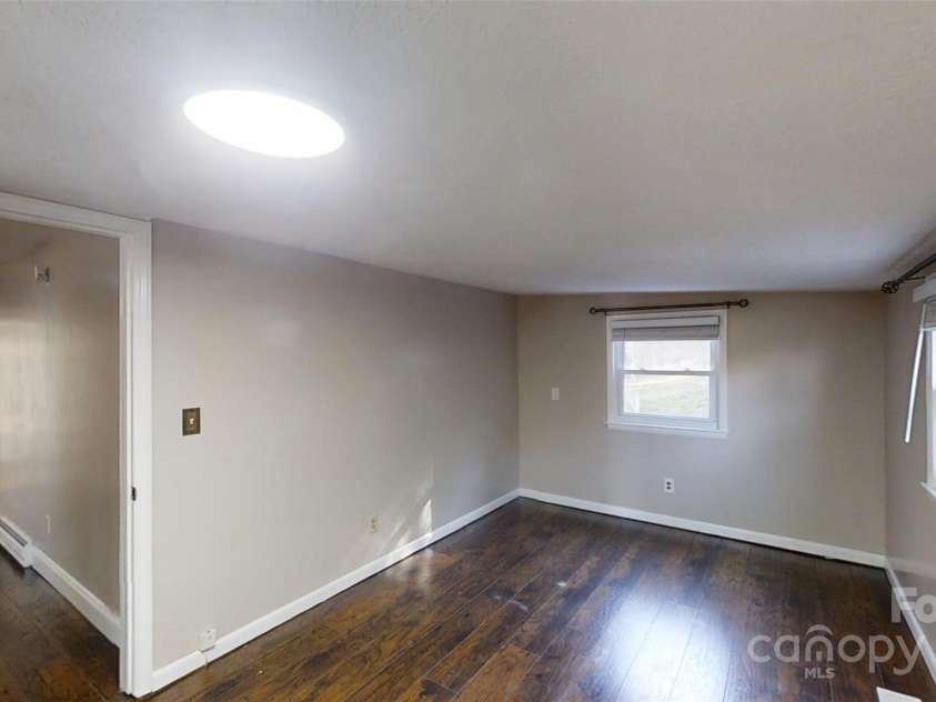 59 Upper Saw Branch Road, Candler, NC 28715.  MLS# CAR4226917, YatesRealty ID 13059. Main bedroom