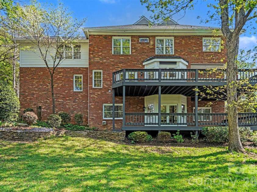 1941 Kilmonack Lane, Charlotte, NC 28270.  MLS# CAR4363894, YatesRealty ID 13079. Backyard with double deck exterior view