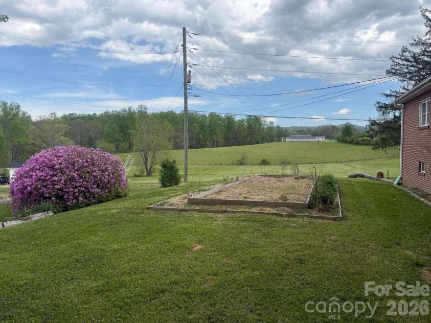 343 Brickyard Road, Etowah, NC 28729.  MLS# CAR4369195, YatesRealty ID 13084. Back view of the home. 