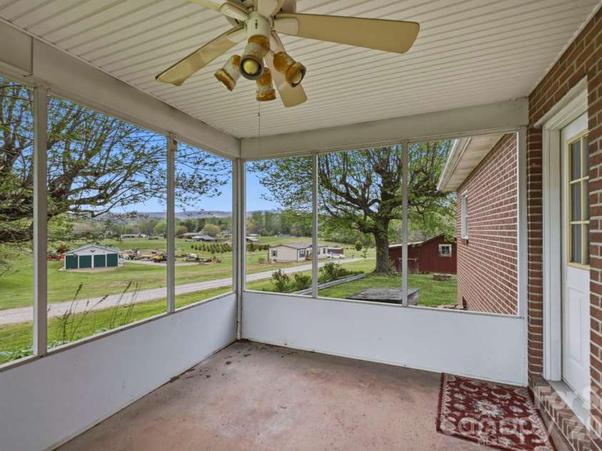 343 Brickyard Road, Etowah, NC 28729.  MLS# CAR4369195, YatesRealty ID 13084. Enclosed porch 