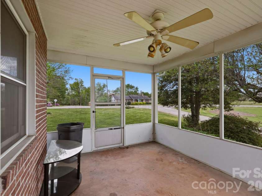 343 Brickyard Road, Etowah, NC 28729.  MLS# CAR4369195, YatesRealty ID 13084. Enclosed porch area 