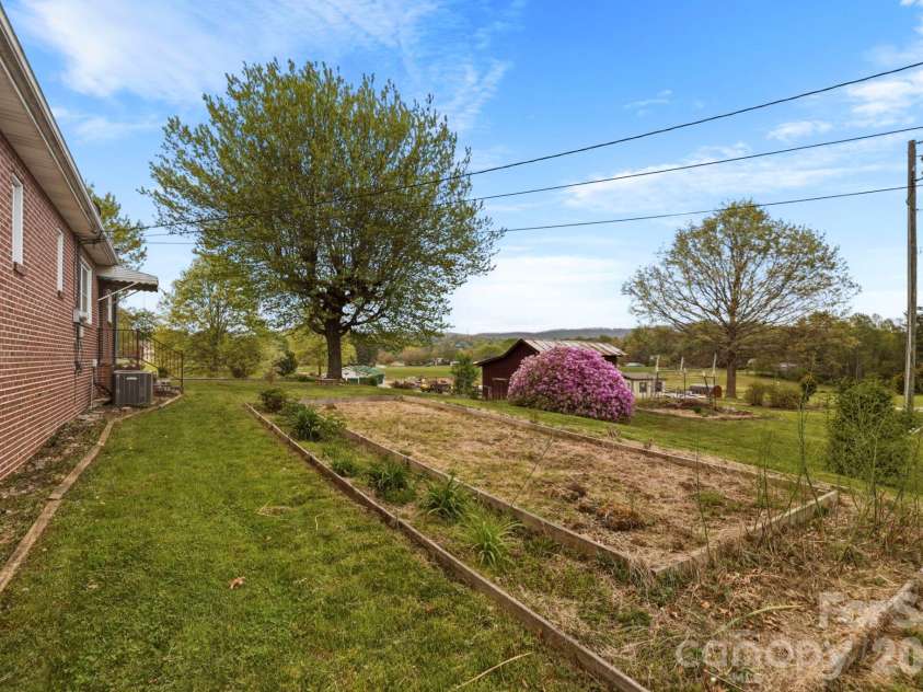 343 Brickyard Road, Etowah, NC 28729.  MLS# CAR4369195, YatesRealty ID 13084. Large backyard 
