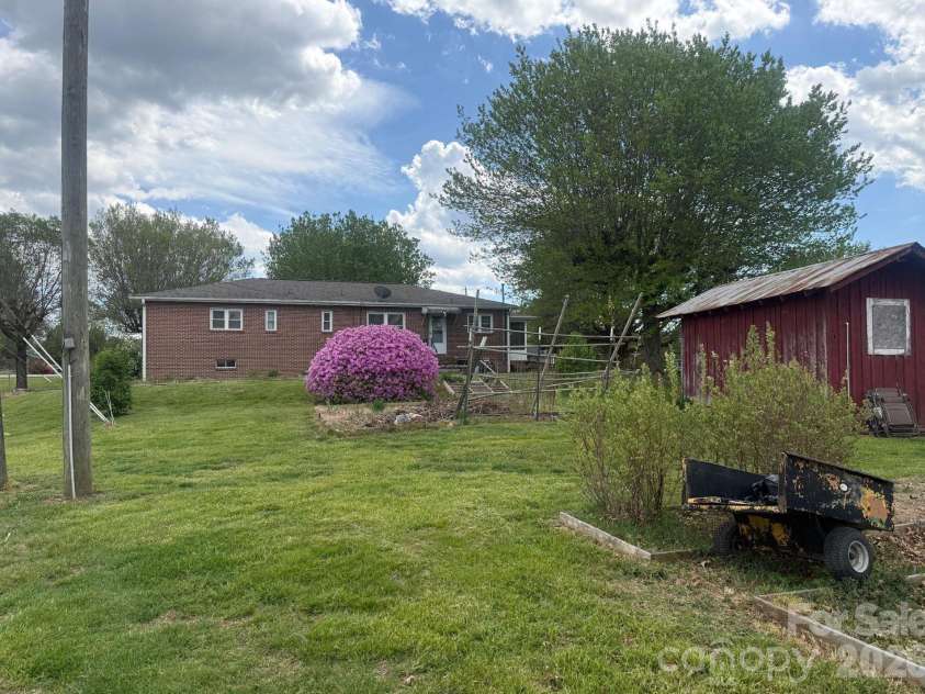 343 Brickyard Road, Etowah, NC 28729.  MLS# CAR4369195, YatesRealty ID 13084. Large backyard 
