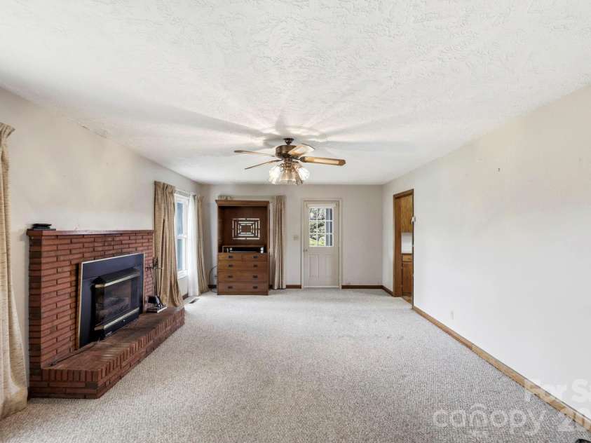 343 Brickyard Road, Etowah, NC 28729.  MLS# CAR4369195, YatesRealty ID 13084. Living room 
