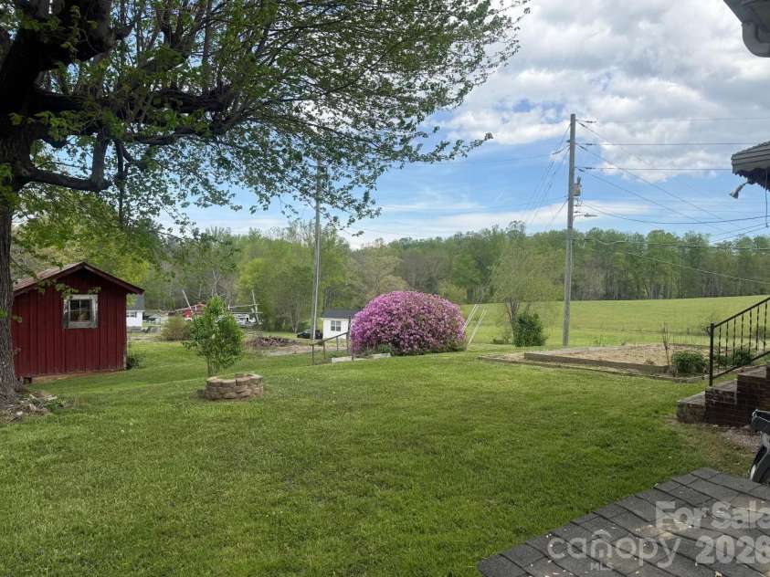 343 Brickyard Road, Etowah, NC 28729.  MLS# CAR4369195, YatesRealty ID 13084. Nice open back yard 