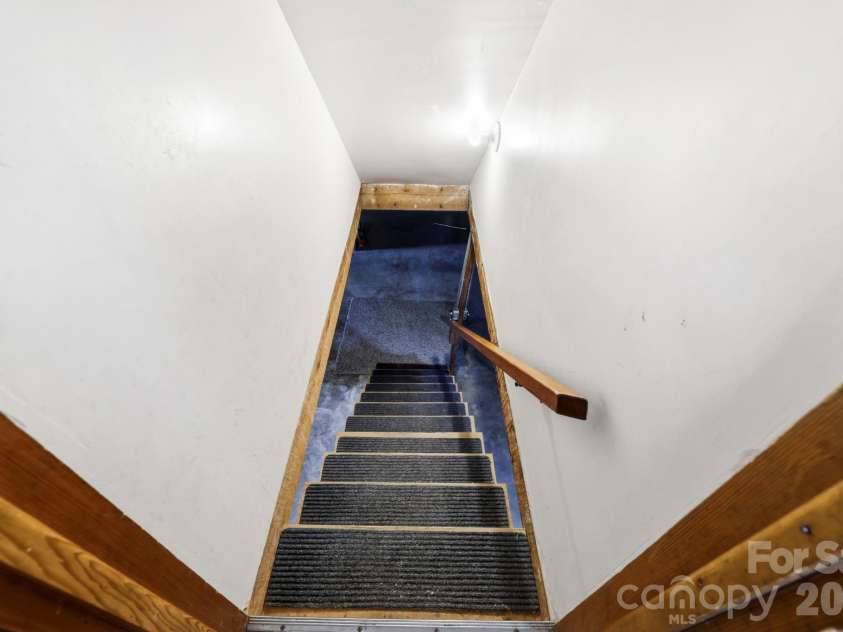 343 Brickyard Road, Etowah, NC 28729.  MLS# CAR4369195, YatesRealty ID 13084. Steps to full basement 