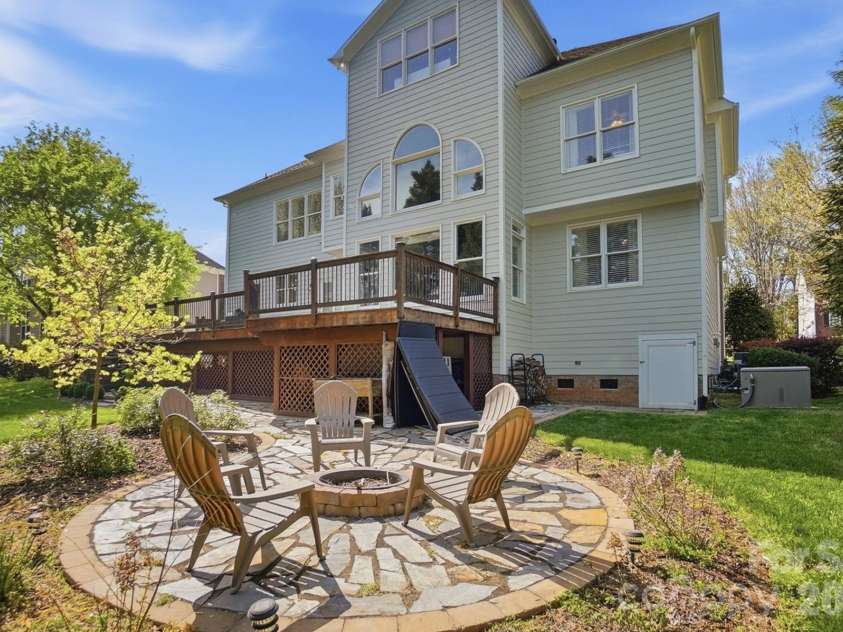 6326 Riverside Oaks Drive, Huntersville, NC 28078.  MLS# CAR4360151, YatesRealty ID 13085. Pavered Firepit in Backyard