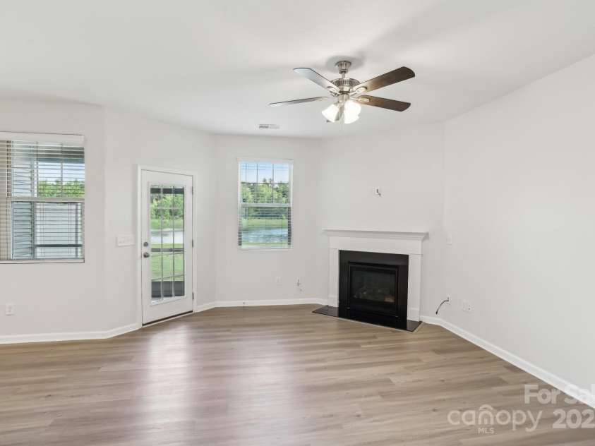 5254 Spanish Ivy Lane, Indian Land, SC 29707.  MLS# CAR4258702, YatesRealty ID 13086. Enjoy the gas fireplace in the winter months! HDMI wired, 2 inch cordless faux wood blinds and great views to water fountain!