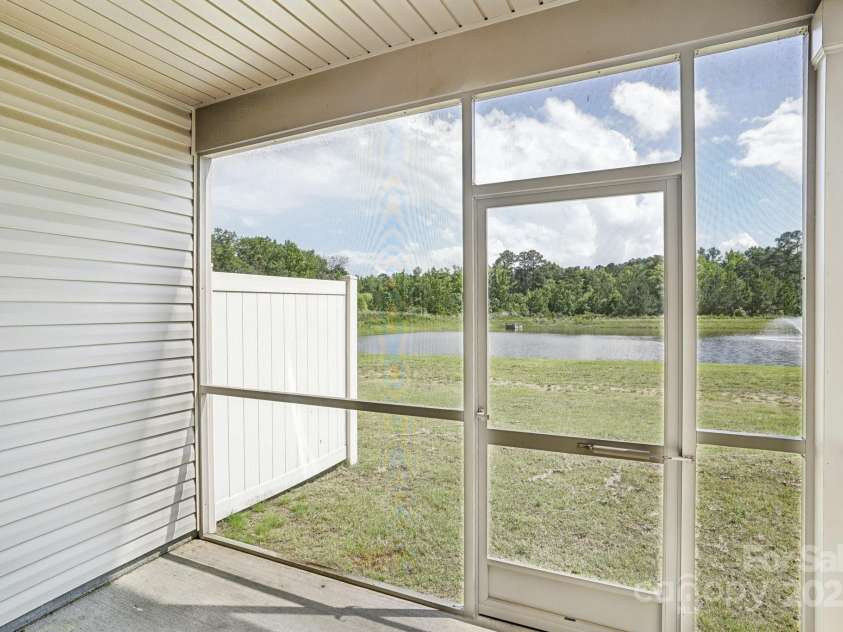 5254 Spanish Ivy Lane, Indian Land, SC 29707.  MLS# CAR4258702, YatesRealty ID 13086. Premium lot looks out to woods and water fountain - private rear yard!