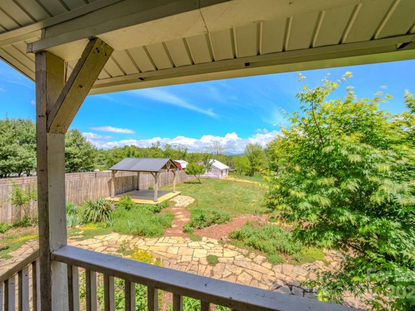 51 Old Nc 20 Highway, Asheville, NC 28806.  MLS# CAR4259014, YatesRealty ID 13089. Mountain views from the serene back porch