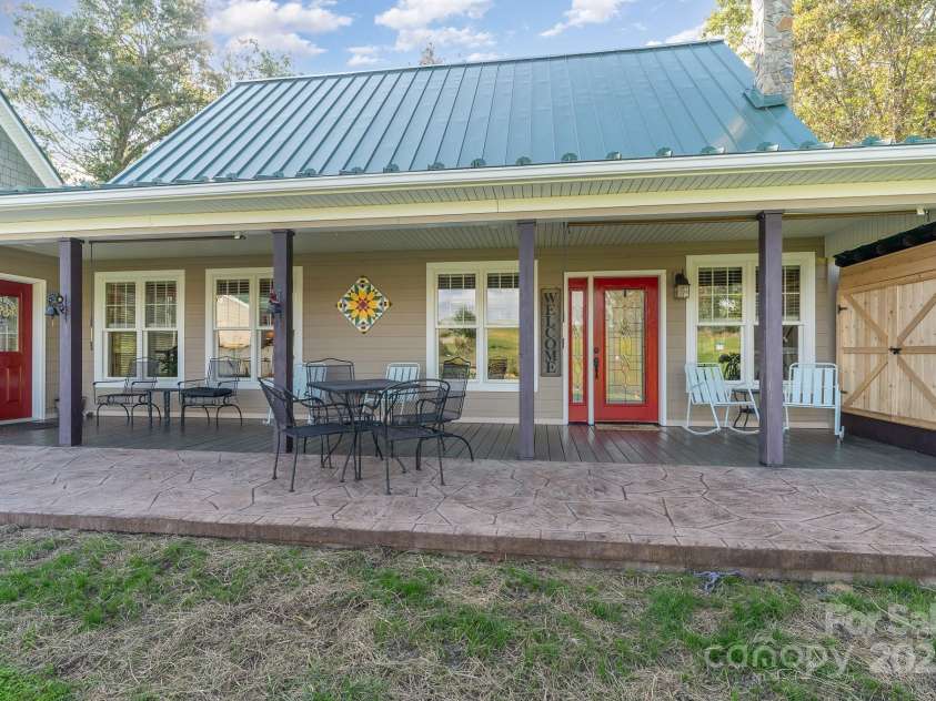 1133 Junior Dairy Road, Ennice, NC 28623.  MLS# CAR4189212, YatesRealty ID 1309. Wide front porch with stamped concrete
