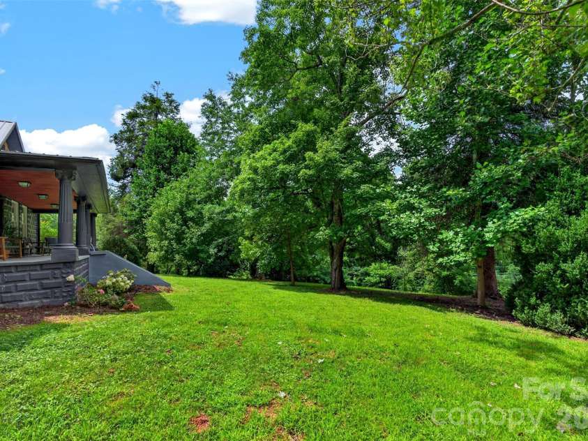 385 Chunns Cove Road, Asheville, NC 28805.  MLS# CAR4397492, YatesRealty ID 1309. Sprawling front yard