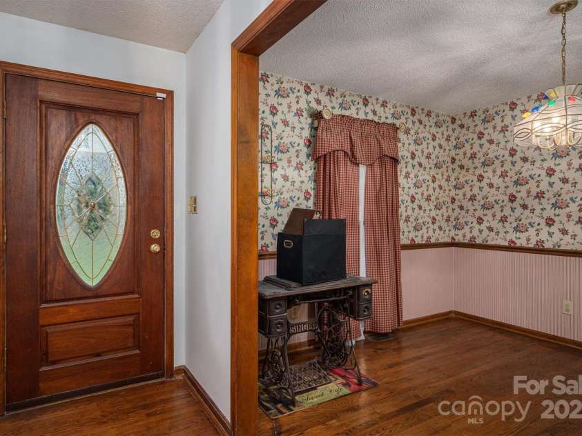 480 Ingleside Farm Road, Iron Station, NC 28080.  MLS# CAR4252019, YatesRealty ID 13093. Front Door/Dining Room