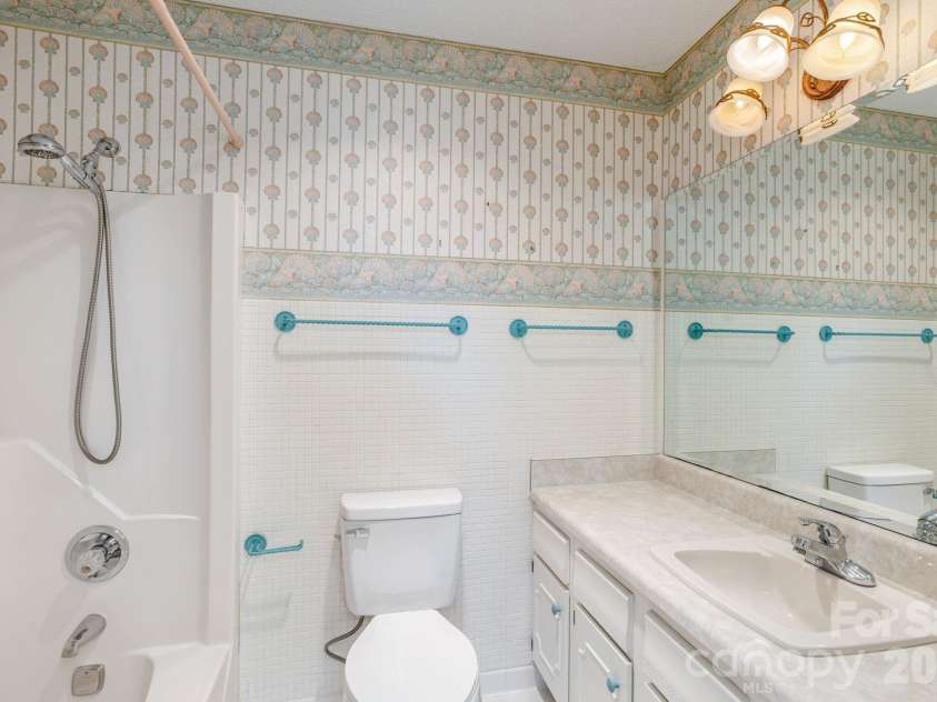 3113 Primrose Drive, Hendersonville, NC 28792.  MLS# CAR4359967, YatesRealty ID 13099. Hall bathroom
