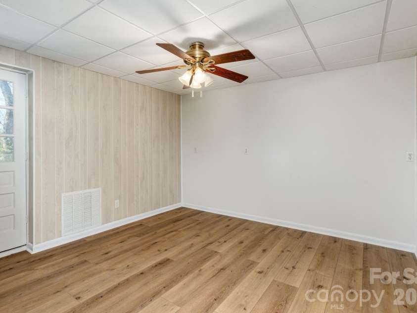 3113 Primrose Drive, Hendersonville, NC 28792.  MLS# CAR4359967, YatesRealty ID 13099. Lower level bedroom/office/hobby