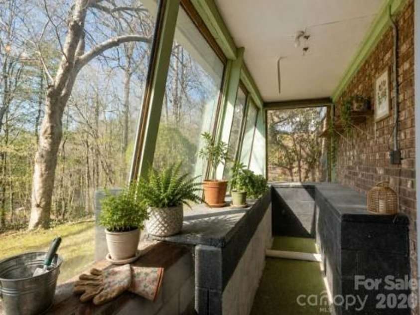 3113 Primrose Drive, Hendersonville, NC 28792.  MLS# CAR4359967, YatesRealty ID 13099. Virtually staged greenhouse